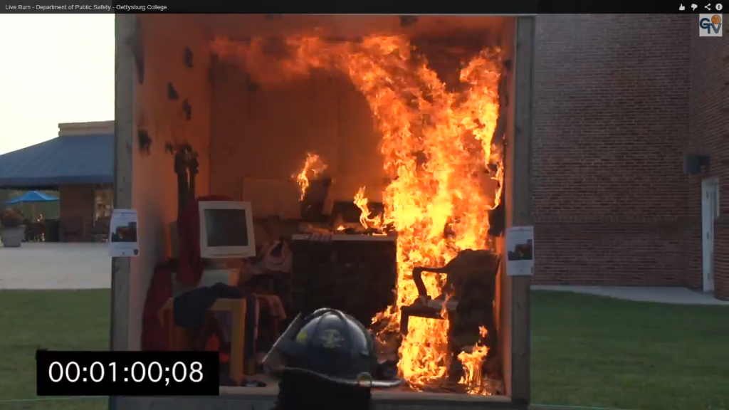 A screencap of Gburg TV's video coverage of the Live Burn event, staged by DPS in order to teach about fire safety.