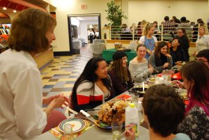 President Janet Morgan Riggs converses with students at Servo Thanksgiving (Photo Jamie Welch / The Gettysburgian)