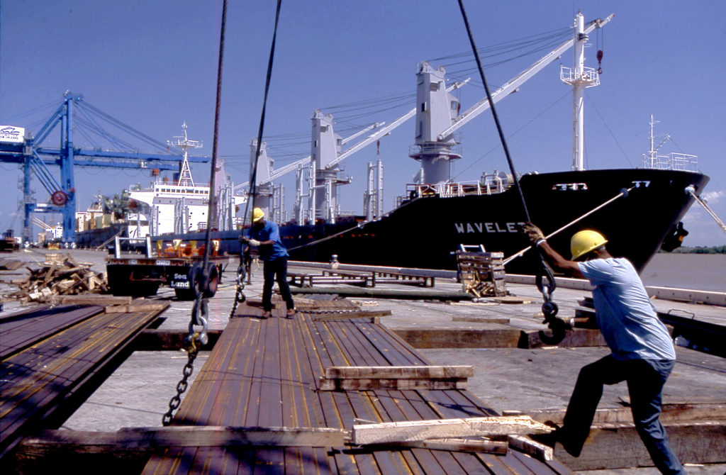 A worker loads steel on a wharf at the Port of New Orleans (stock photo). Kerr argues that Donald Trump’s trade policies needlessly risk a trade war with China.