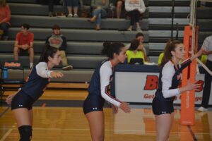 Cat Holtz '24 (left), Kuba McCoy (center), and Bayer (right) ready to make a play (Luca España/The Gettysburgian)