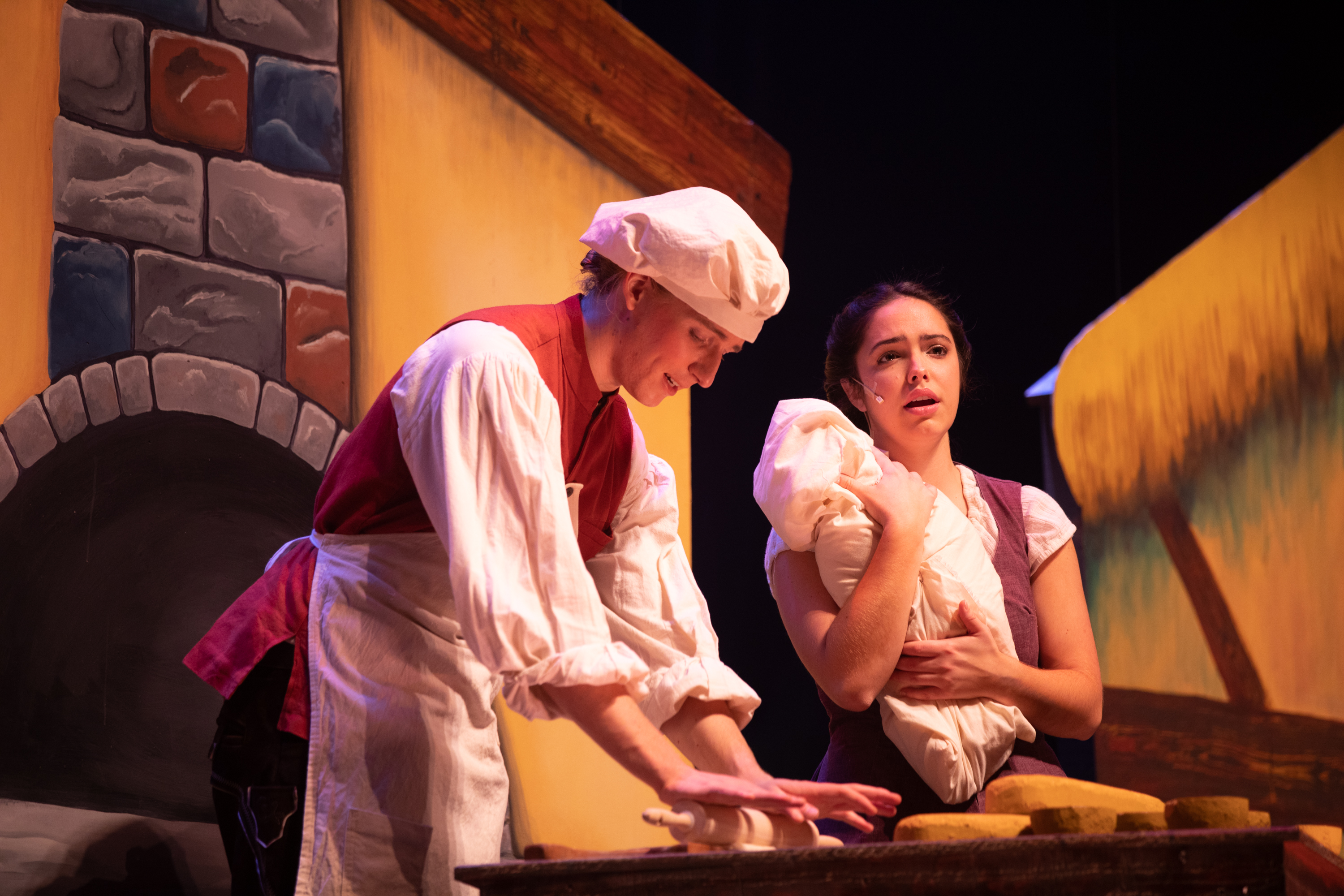 The Baker (Zach de Besche), the Baker's Wife (Allie Charney), and their child at the beginning of Act II (Photo courtesy of Gettysburg College/Abbey Frisco)