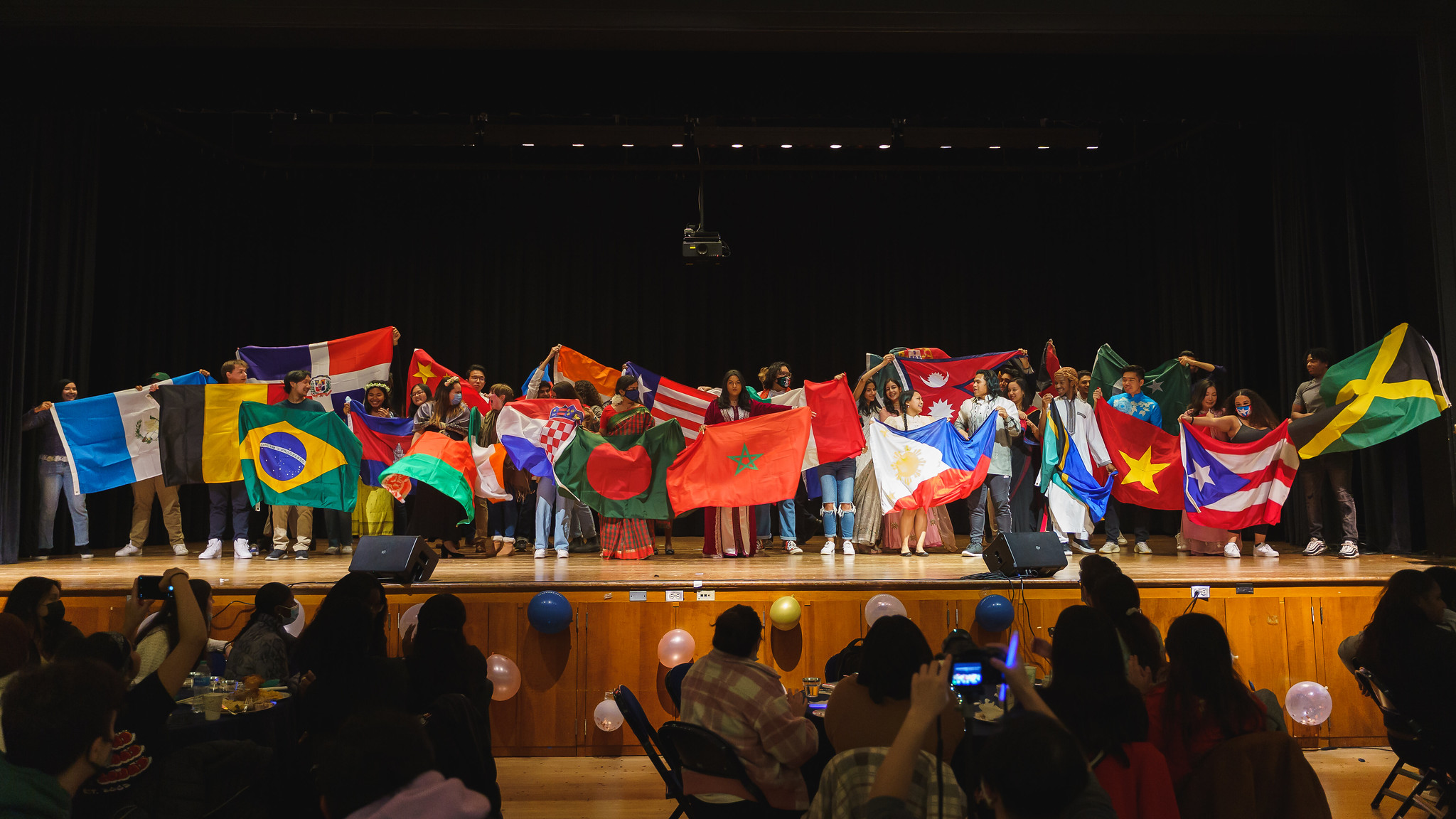 Students present their country flags at the end of the event (Photo Credit/ Anh Nguyen '22).