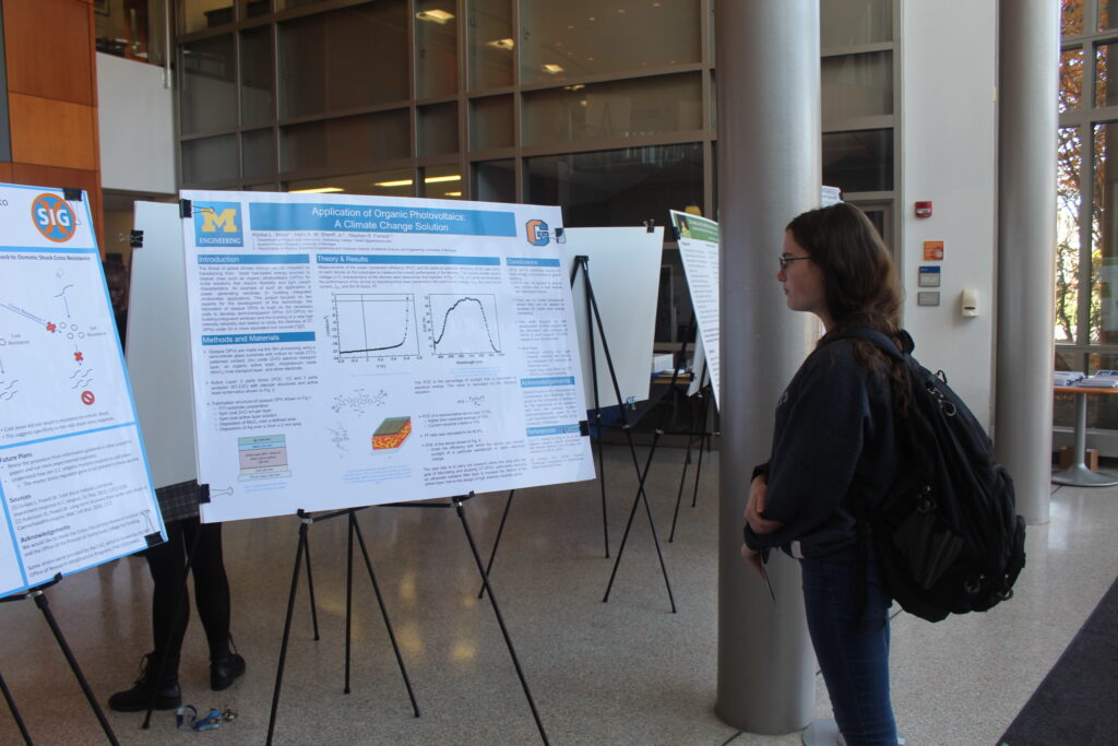 A student reads an X-SIG presentation on Friday, Oct. 28, 2022 (Photo Annie Bolenbaugh/The Gettysburgian)