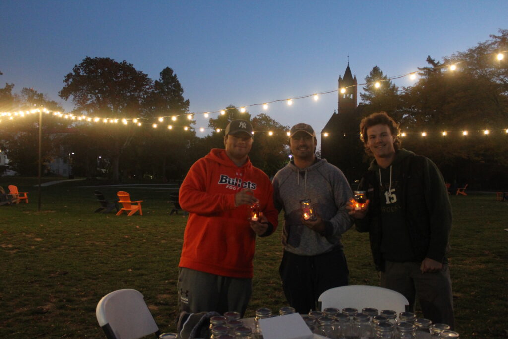 Students hold candles at the Pink Party event (Photo Annie Bolenbaugh/The Gettysburgian)