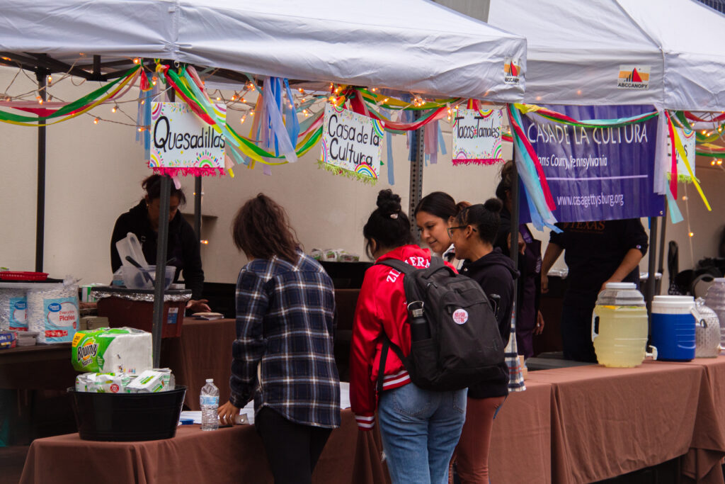 Students visiting a tent at Salsa on the Square (Photo Will Oechler/The Gettysburgian)