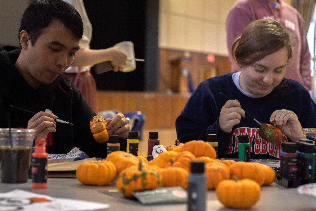 Students paint pumpkins at the First-Year Fall Fest on Oct. 1 2022 in the CUB Ballroom (Photo Will Oehler/The Gettysburgian)