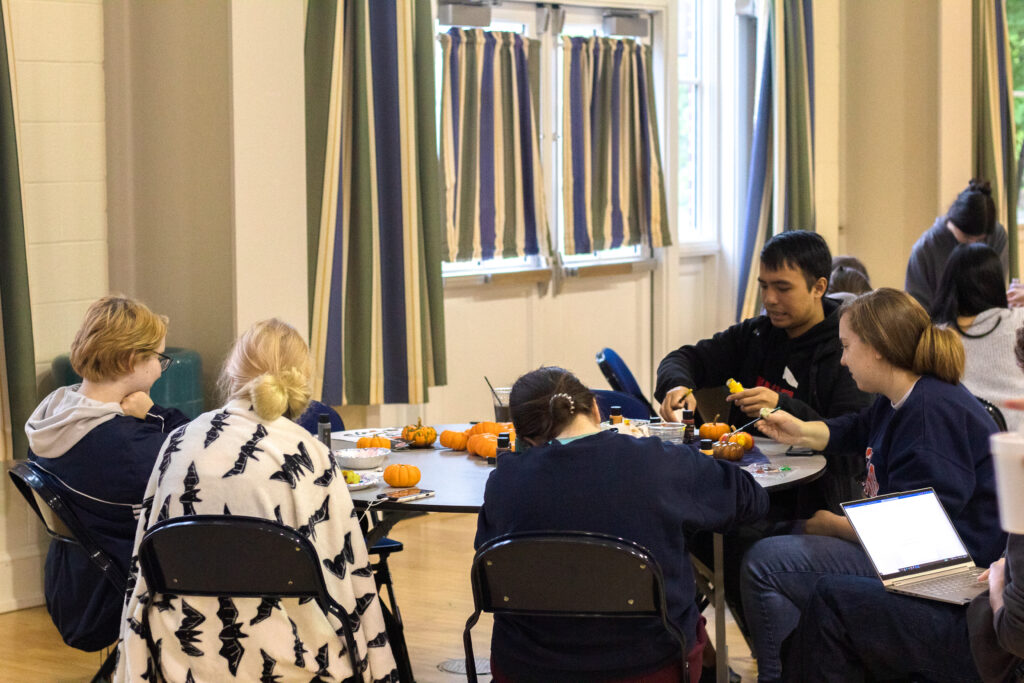 Students paint pumpkins at the First-Year Fall Fest on Oct. 1, 2022 in the CUB Ballroom (Photo Will Oehler/The Gettysburgian)