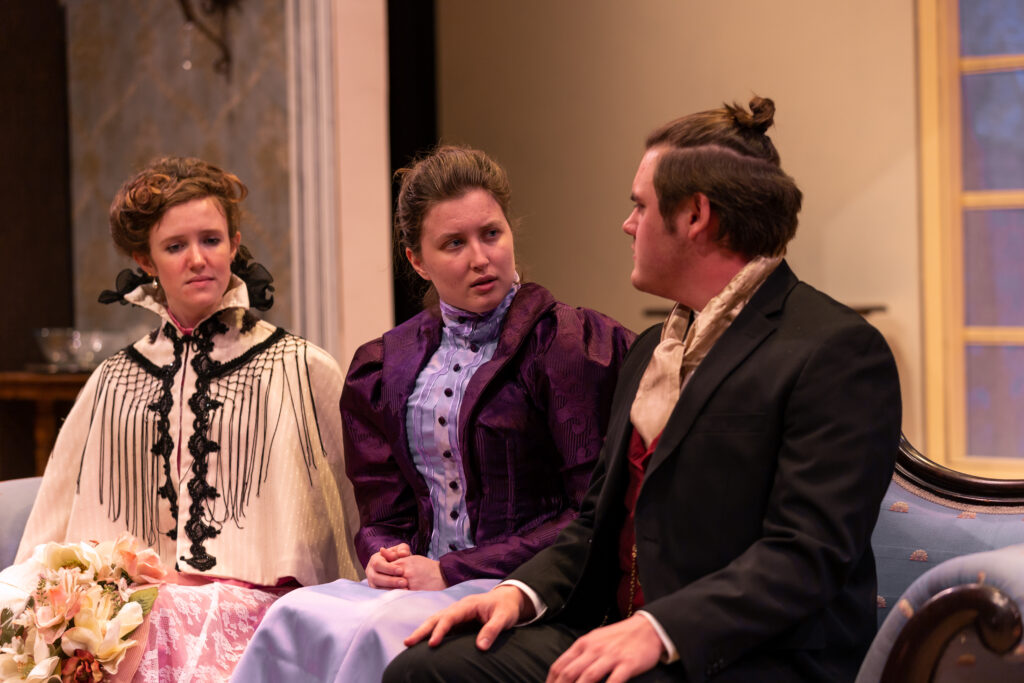 From left to right: Libby Drew '24 plays Thea Elvsted, Roisin Daly ’23 plays Hedda Tessman (nee Gabler), and Alex Sanchez '23 plays Ejlert Lövborg in "Hedda Gabler" (Photo Eric Lippe/The Gettysburgian)