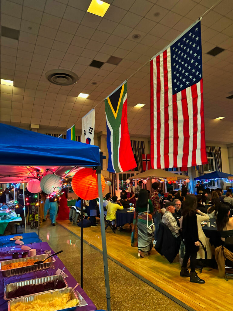 Booths set up with food from each Cultural Club. (Photo Abror Niyazmetov/The Gettysburgian)