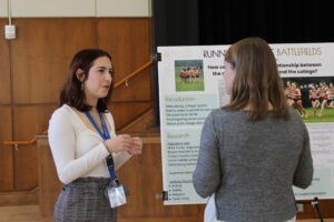 A student discusses their research with an attendee. (Photo Jessica Chernoff/The Gettysburgian)