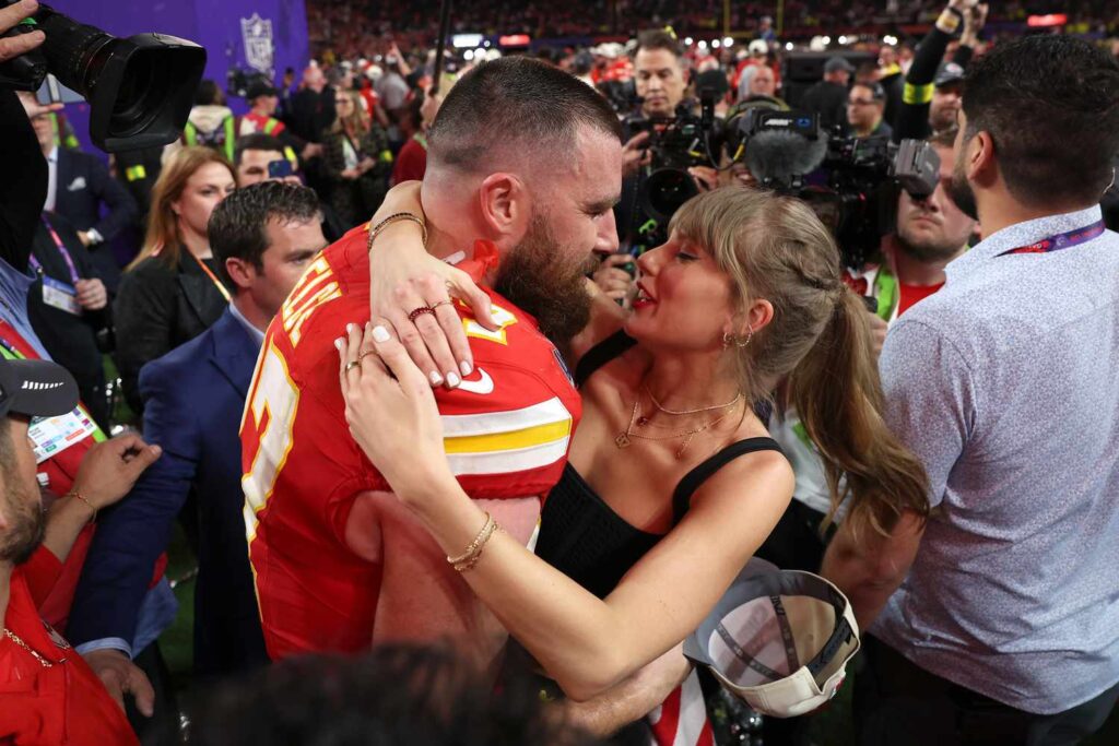 Taylor Swift and Travis Kelce embracing after the Chiefs' Super Bowl win. (Photo Ezra Shaw/Getty Images)